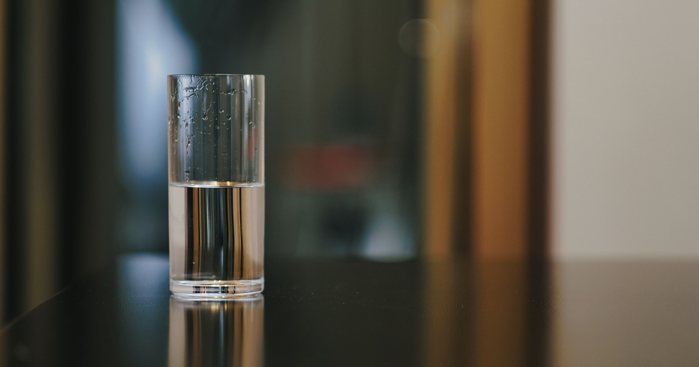 A half-full glass of water in close-up